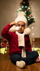 Fototapeta na wymiar happy Indian child boy with christmas tree 