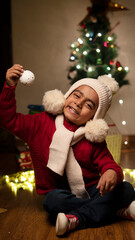 happy Indian child boy with christmas tree 