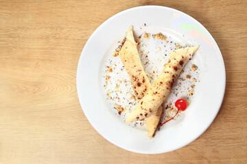 original cheesecake with blueberries on plate on wooden