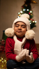 happy Indian child boy with christmas tree 