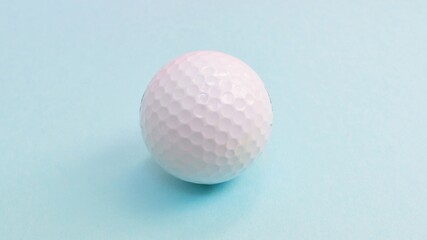 Golf ball isolated on blue background