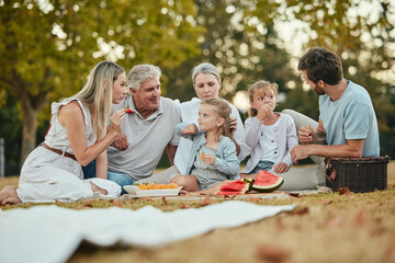 Happy family, park picnic and summer with fruit, eating and love in nature, holiday and bonding in...