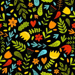 Print. Bright floral background. Bright multicolored flowers on a black background. Botanical pattern. Summer seamless background. Fabric, paper, wallpaper.