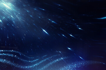background of abstract blue and silver glitter lights. defocused