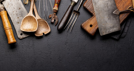 Cooking utensils on kitchen table - obrazy, fototapety, plakaty