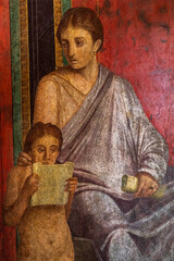 Ancient Roman fresco in Pompeii showing a detail of the mystery cult of Dionysus. Pompeii destroyed by the eruption of Vesuvius in 79 BC - 555365402