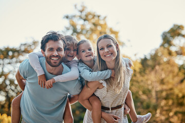 Family, park and portrait of parents with kids enjoying summer holiday, weekend and quality time outdoors. Love, nature and happy mother, father and children smiling, bonding and relax together