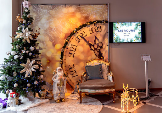 Latvia, Riga, December, 2022 - Christmas tree and New Year holiday decoration in the interior of the Mercure hotel in Riga, Latvia. Festive interior design.