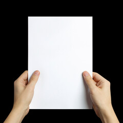Hands holding a sheet of white paper, isolated on black background