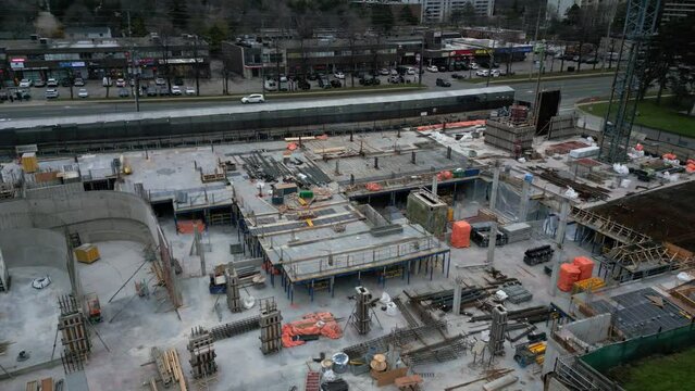 Aerial drone orbiting around an empty construction site in Toronto, Ontario, Canada