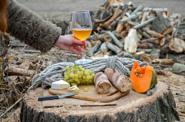 Glass of white wine in female hand, wine tasting