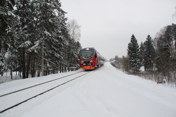 Train in snowy winter country place in cloudy day