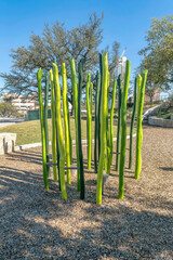 Fototapeta premium Austin, Texas- Playground at Waterloo Park with painted green wood obstacle