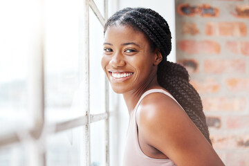 Face portrait, black woman and smile in gym by window after workout, training or exercise. Sports,...