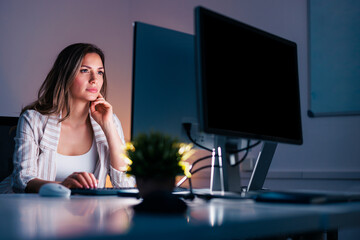 Woman working overtime in the office