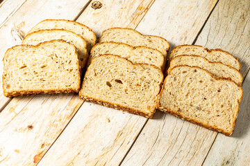 slices of wholegrain bread with cereal on wooden table