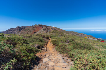 Hiking track with astronomical observatories on top of the mountain