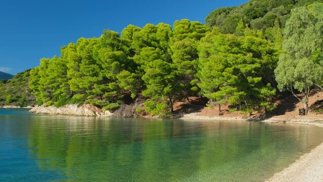 Beautiful Skinos beach with pine trees forest, Ithaki island, Kefalonia, Greece