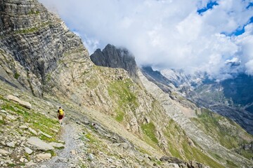 A man hikes the trail to Balcon de Pineta, a popular route in the Spanish Pyrenees