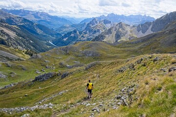 Man facing away hiking in the Valle de Tena in the Spanish Pyrenees