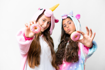 Friends girls with unicorn pajamas over isolated white background