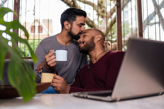 Intimate Gay Couple Moment, Enjoying A Cup Of Coffee At Home