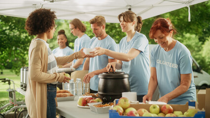 Group of Volunteers Preparing Free Food Rations for Poor People in Need. Charity Workers and...