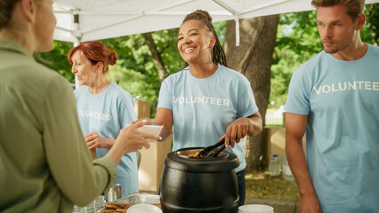 Group of Volunteers Preparing Free Food Rations for Poor People in Need. Charity Workers and...