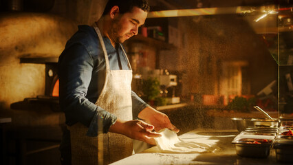 In Restaurant Professional Chef Preparing Pizza, Kneading Dough, Spinning and Tossing it, Traditional Family Recipe. Authentic Pizzeria with Deliciously Organic Food. Cinematic Sunny Shot
