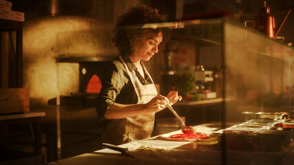 In Restaurant Professional Female Chef Preparing Pizza, Adding Ingredients, Special Sauce, Cheese, Traditional Family Recipe. Authentic Sunny Italian Pizzeria, Cooking Organic Food