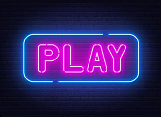 Play neon sign on brick wall background.