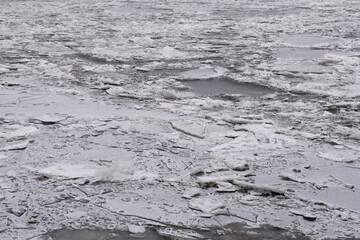 ice on the river, the water surface freezes in cold winter