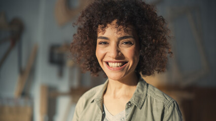 Close Up Portrait of a Multiethnic Brunette with Curly Hair and Brown Eyes. Happy Creative Young Woman Charmingly Smiling and Feeling Joyful. Thinking Up Ideas About Greater Future. - obrazy, fototapety, plakaty