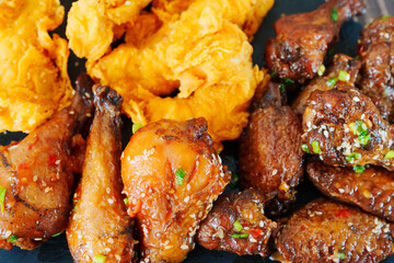 caramelized chicken with sesame and garlic, meat strips in breadin.