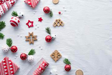 Blessed Yule, Christmas, Latvian winter festival. Ethnographic symbols and patterns from Latvia, wood amulets, wrapping paper, gift boxes with fir twigs and berries. Baltic seasonal patterns in red.