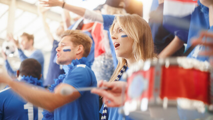 Sport Stadium Big Event Tribune: Crowd of Real Fans Cheer for their Blue Soccer Team that Loses, Misses the Goal. People are Sad and Dissappointed. Group of Friends with Painted Faces Cheer, Shout