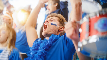 Sport Stadium Big Event: Handsome Happy Caucasian Man Emotionally Cheers, Screams. Crowd of Fans...