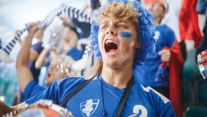 Sport Stadium Big Event: Handsome Caucasian Drummer, Man Cheering. Crowd of Fans with Painted Faces...
