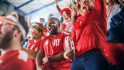 Sport Stadium Soccer Match: Diverse Crowd of Fans Cheer for their Red Team to Win. People Celebrate...