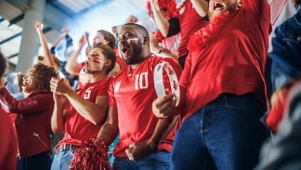 Sport Stadium Soccer Match: Diverse Crowd of Fans Cheer for their Red Team to Win. People Celebrate...