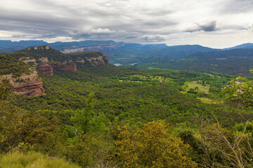 Aerial panoramic view of the Guilleries Natural Park with the Tavertet cliffs in the background. Catalonia, Spain