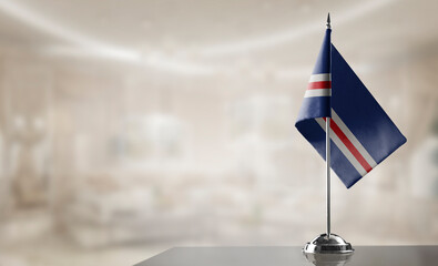 A small Cape Verde flag on an abstract blurry background
