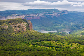 Obraz premium Aerial view of the Sau reservoir with the Collsacabra cliffs in the background. Guilleries Natural Park, Catalonia, Spain
