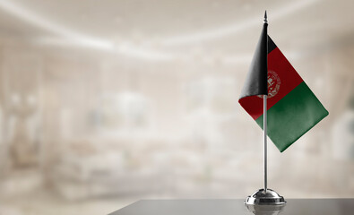 A small Afghanistan flag on an abstract blurry background