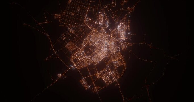 Tabuk (Saudi Arabia) Top View At Night. View On Modern City From Satellite. Camera Is Zooming In, Rotating Counterclockwise. Vertical Video. The North Is On The Left Side