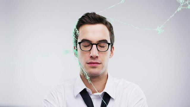 Silly string, party and man face at a wedding or social event photobooth to celebrate. Male portrait of a person on new year or fun birthday gathering at night with glasses, confetti and smile