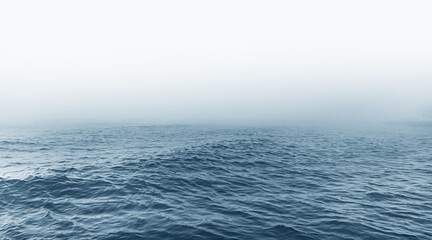 Fog on the sea. Seascape with waves and fog on the horizon.