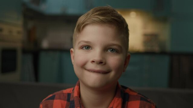 Smiling 7 Years Old Kid Portrait. Happy child's smile without baby teeth. Cute boy looking at camera.