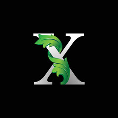 Initial letter X, 3D luxury green leaf overlapping white serif font on black background
