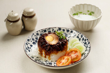 Lo Mai Gai, Steamed Glutinous Rice with Soy Sauce Chicken,  Egg, and Mushrooms